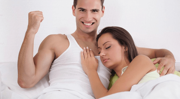 a woman in bed with a man who has greater power